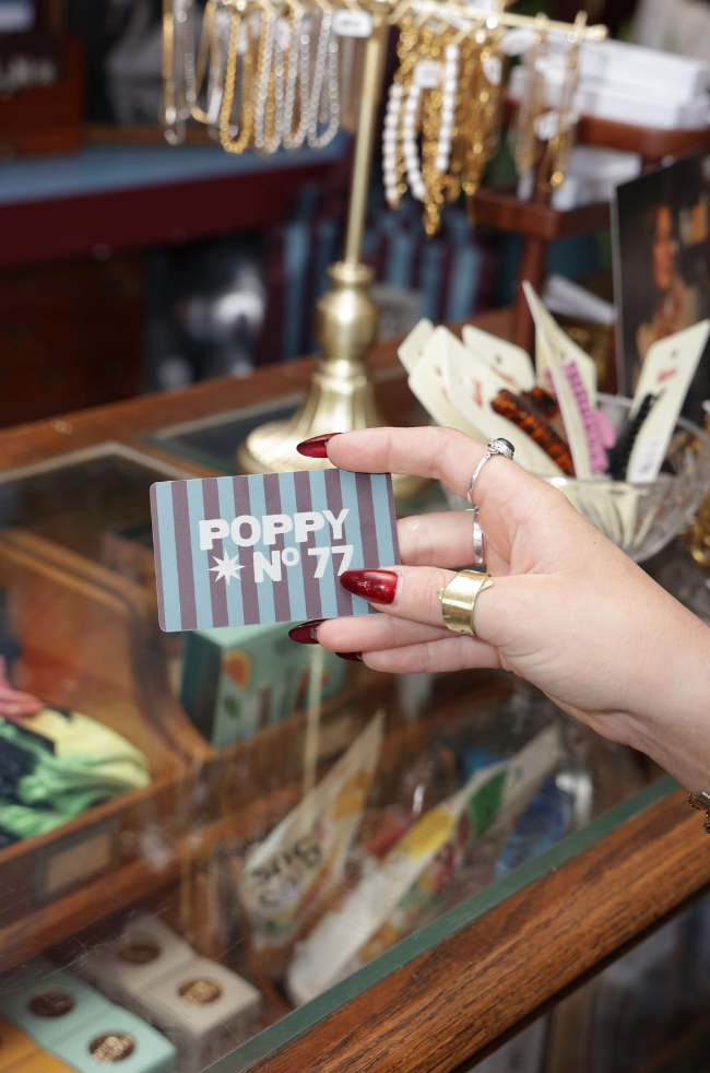 Physical Gift Card in hand, avalible at store
